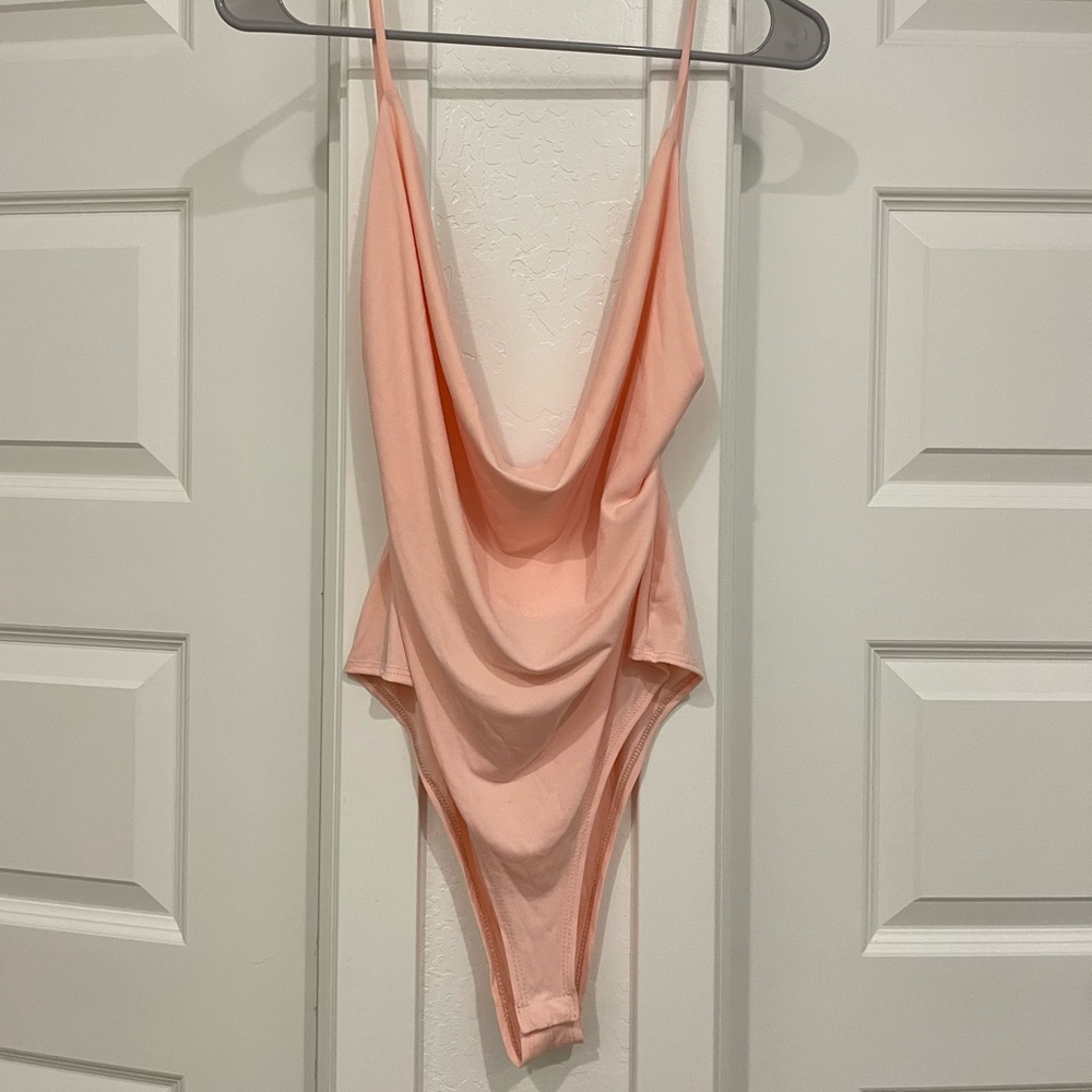 Baby pink body suit